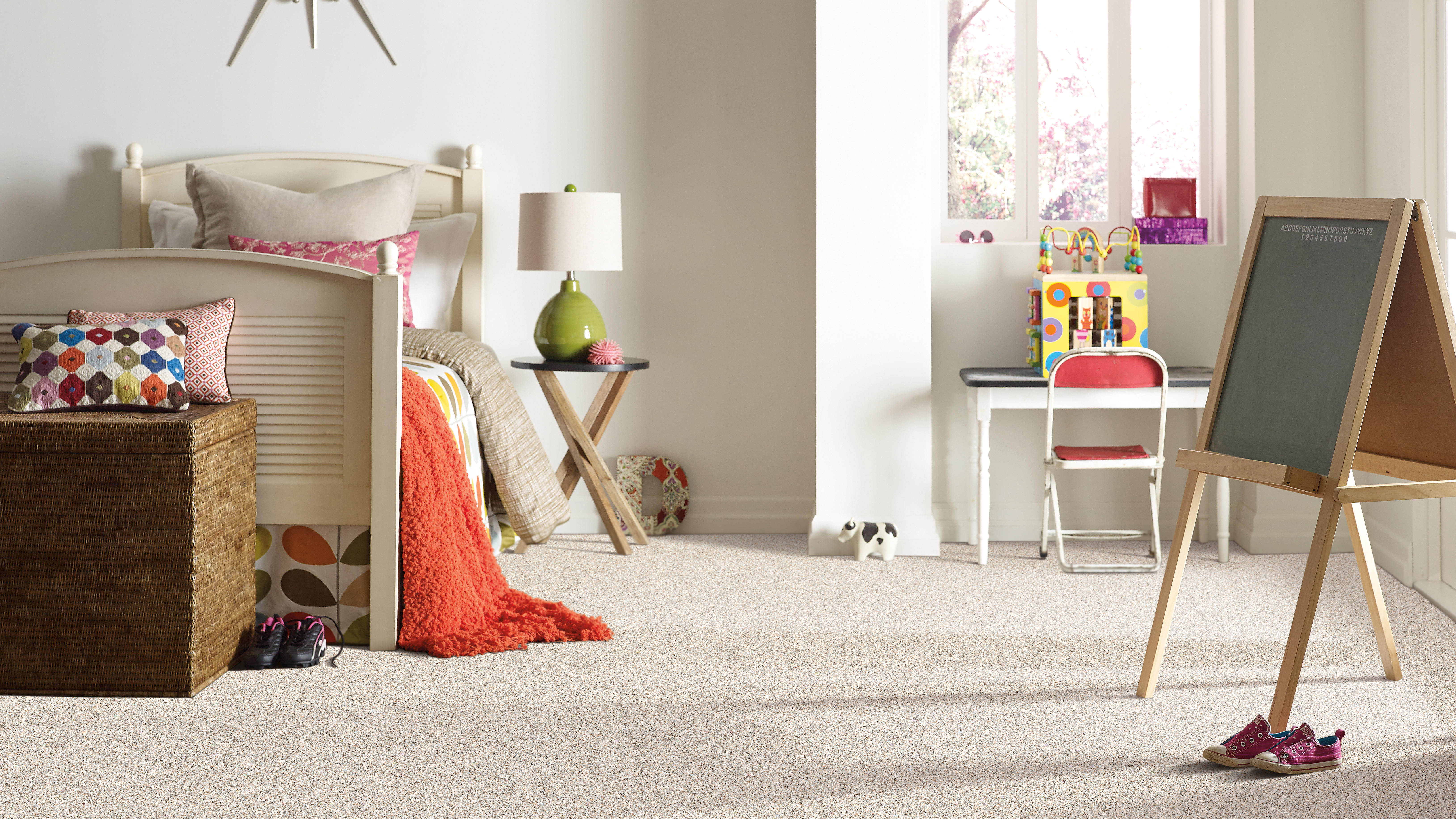 Carpet flooring in a children's bedroom, installation services available. 